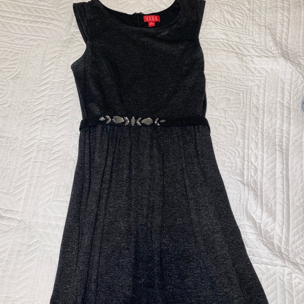 Black dress with black emblem on belt